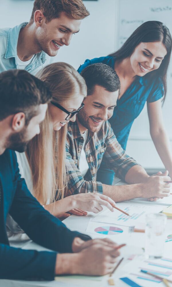 Employees Of A Mobile App Testing Company Demonstrating Their Ability To Work As A Team
